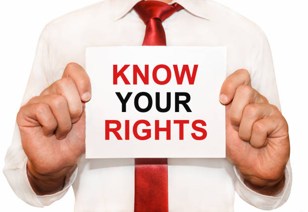 Man holding a card with a text Know Your Rights know-your-rights